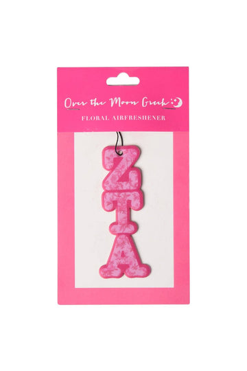 Pink 'ZETA' air freshener in packaging on a white background