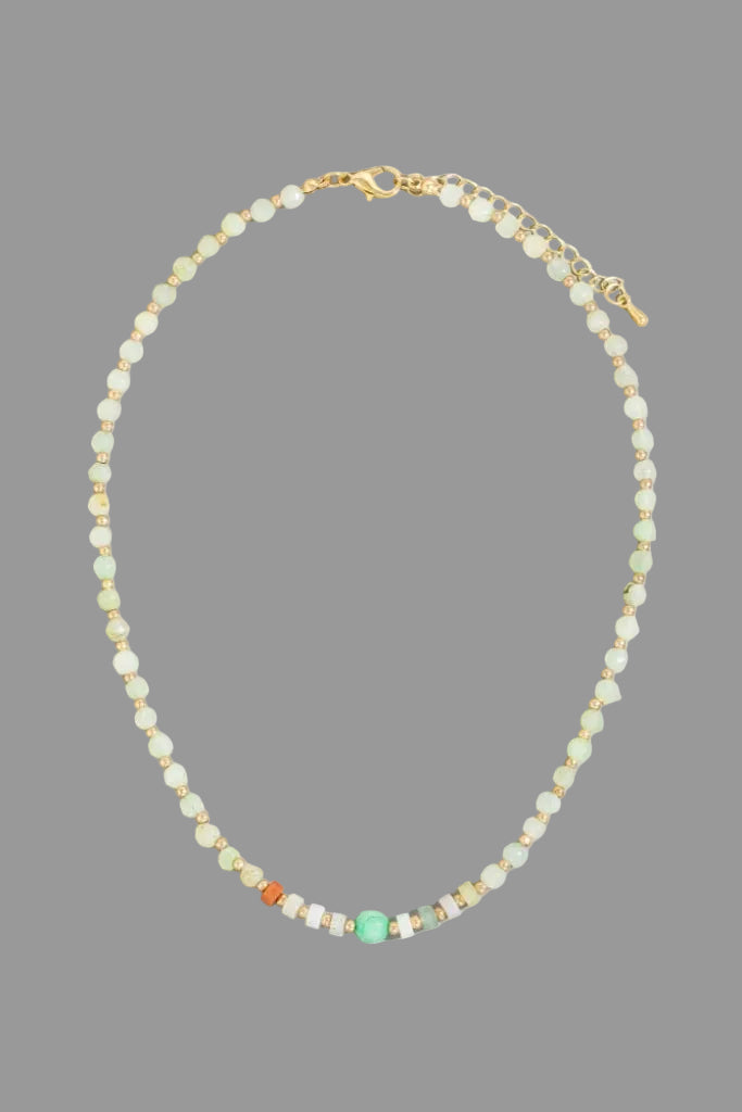 Necklace with small beads on a gray background