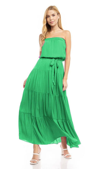 Woman wearing a green strapless dress on a white background