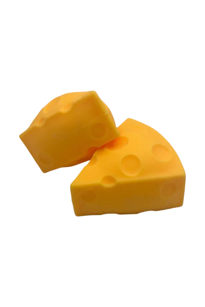 Two yellow cheese-shaped objects on a white background