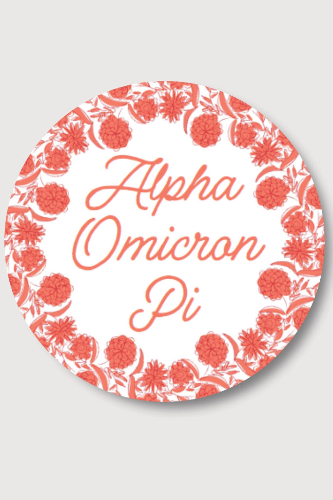 Circular Alpha Omicron Pi logo with floral design on a light gray background