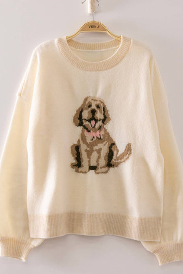 Beige sweater with a dog design on a hanger against a white background