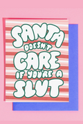 "Santa Doesn't Care If You're A Slut" Greeting Card