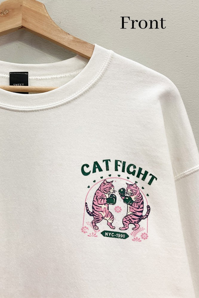Close-up of pink boxing tiger cats Cat Fight NYC 1990 chest graphic