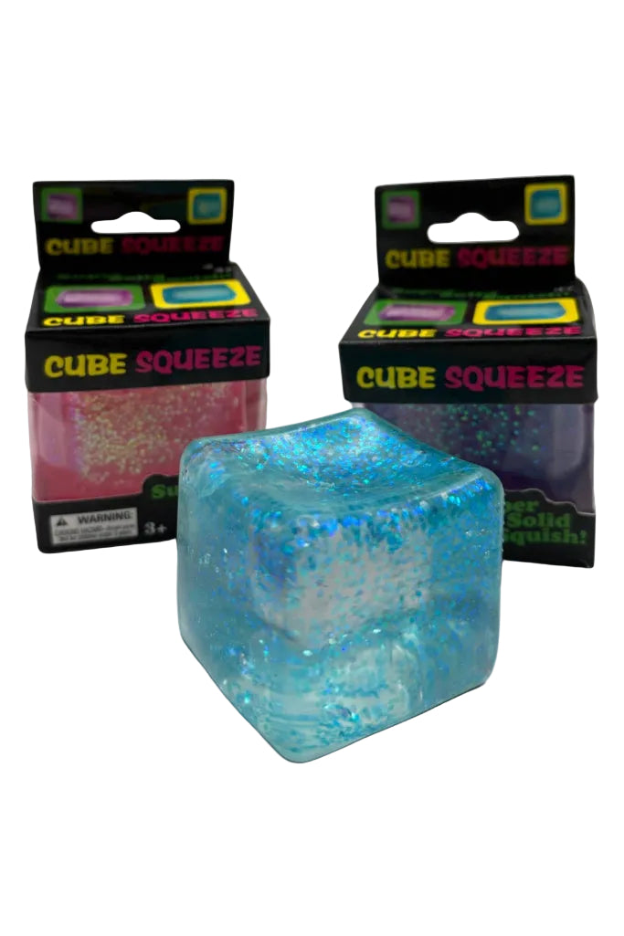 Blue Cube Squeeze toy with packaging in the background