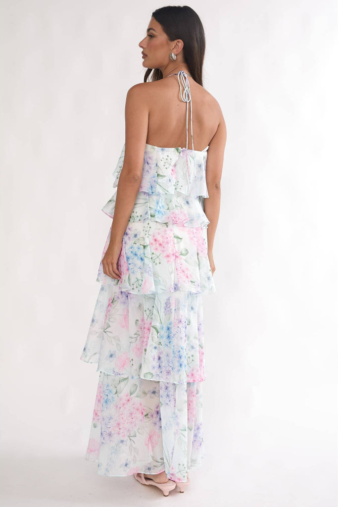 Woman wearing a floral dress with a white background