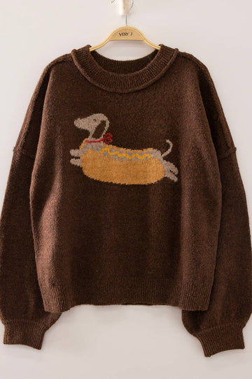 Brown sweater with a dog design on a hanger against a white background