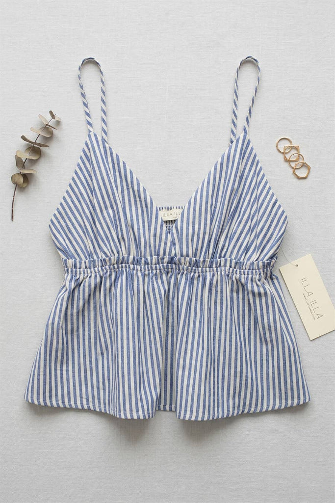 Blue and white striped romper with thin straps on a light gray background