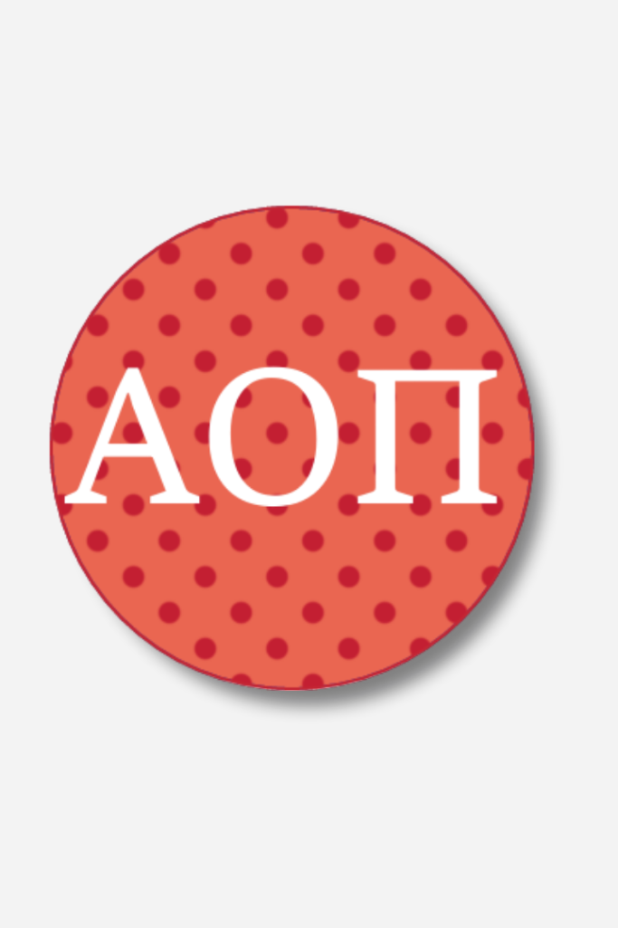 Circular sticker with 'AOI' text on a red polka dot background