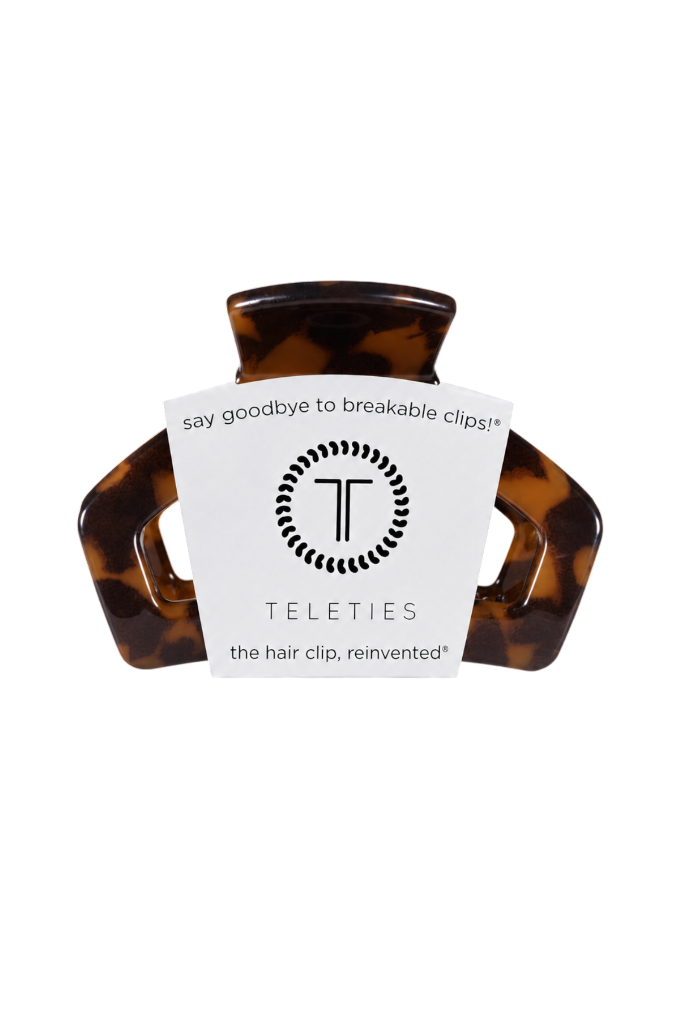 Tortoiseshell hair clip with a white label on a white background