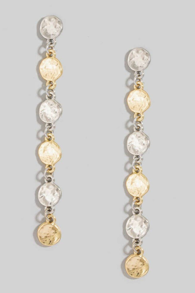 Pair of long, dangling earrings with gold and silver beads on a gray background