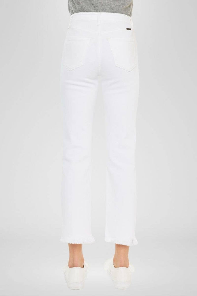 White pants worn by a person on a white background