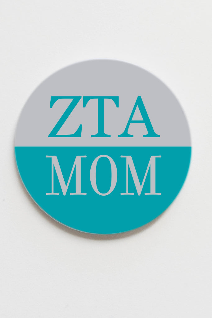 Round coaster with 'ZTA MOM' text on a white background
