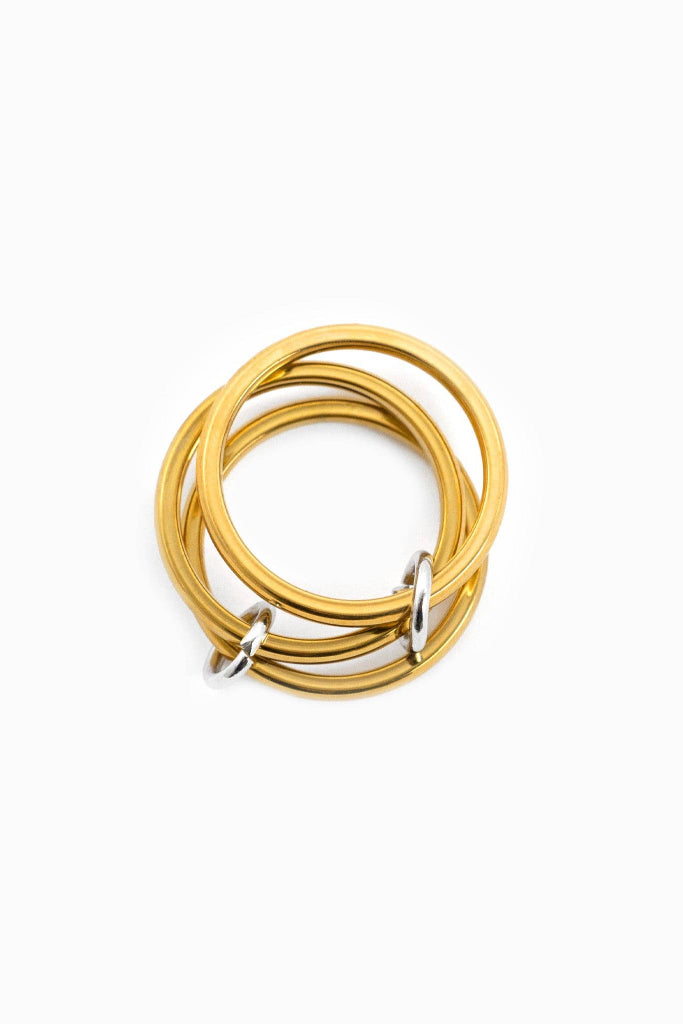 Gold rings stacked on a white background