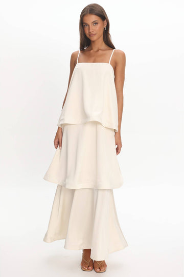 Woman wearing a white dress on a white background
