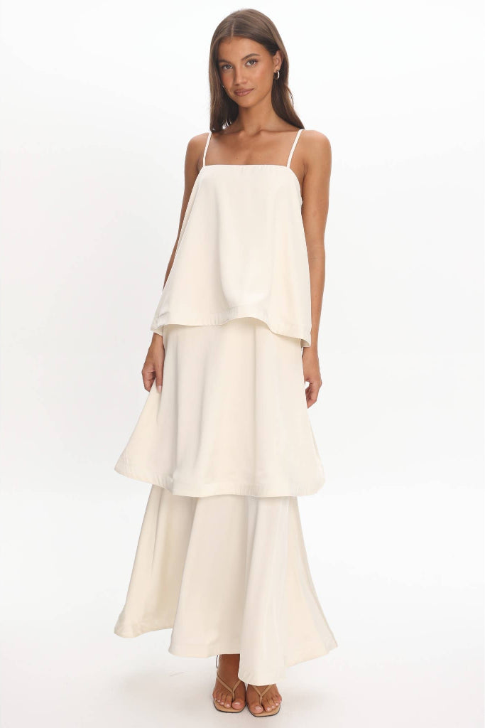 Woman wearing a white dress on a white background