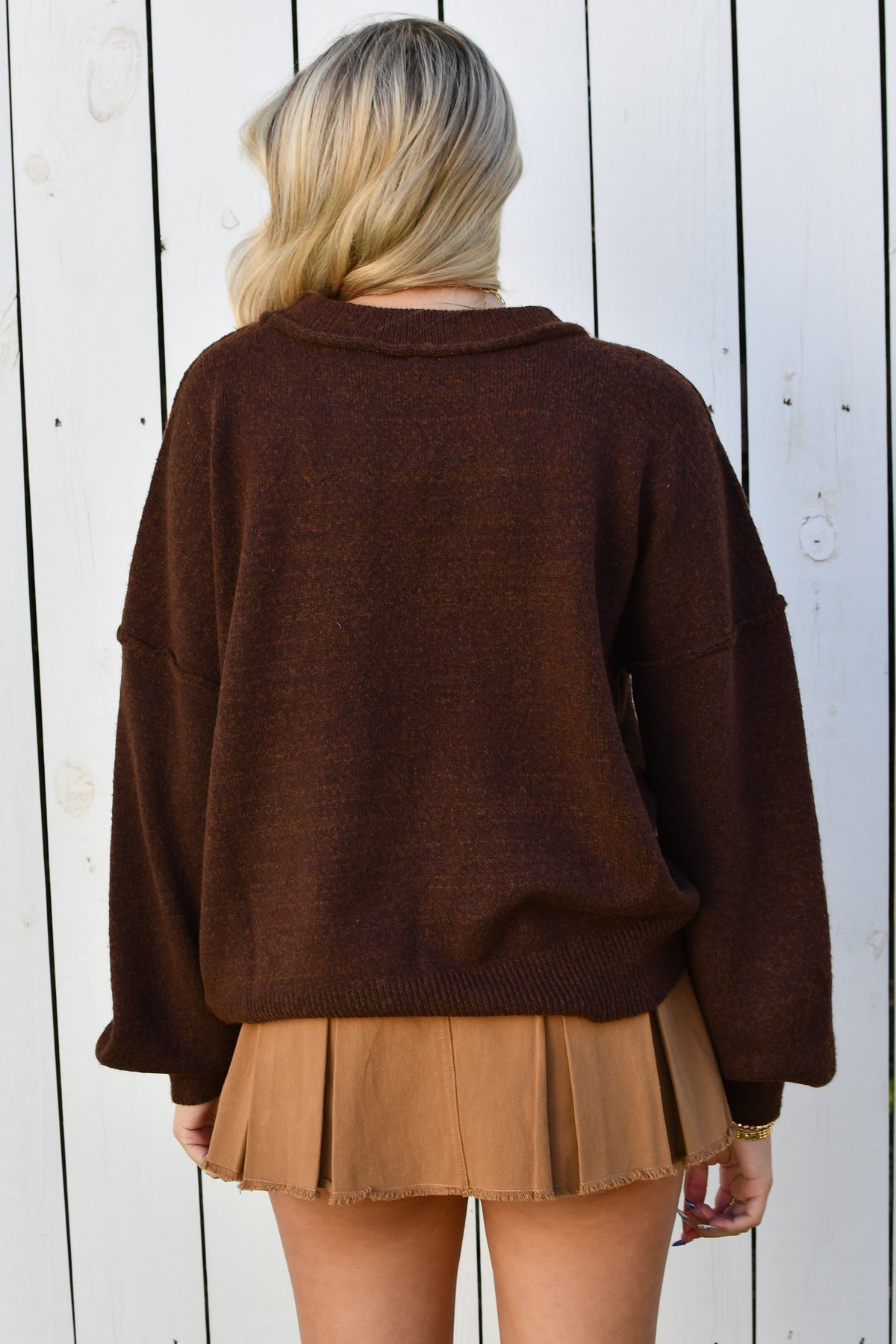 Back of brown fuzzy knit sweater