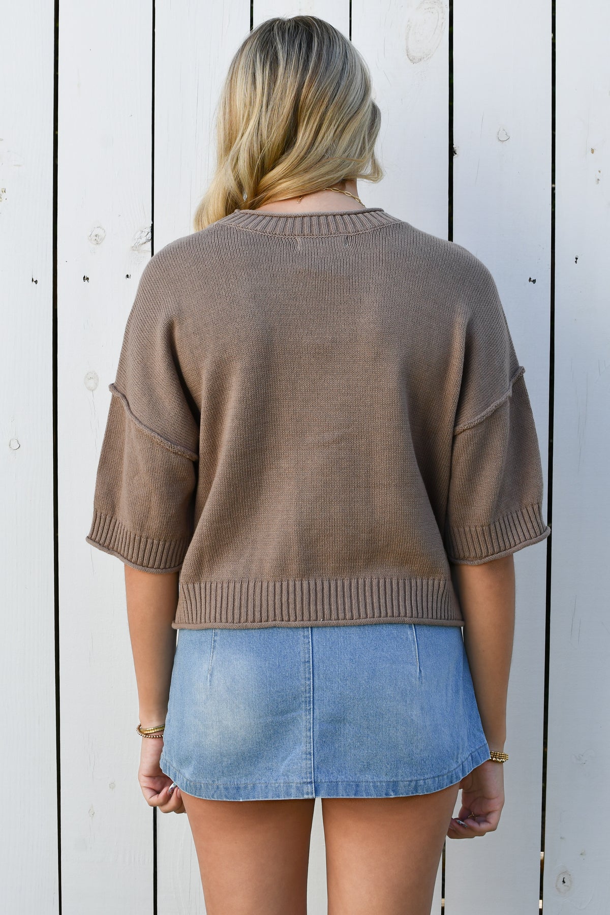 Back of taupe short-sleeve knit top