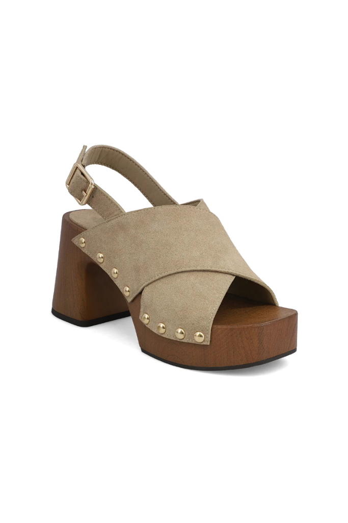 Beige sandal with wooden platform on a white background