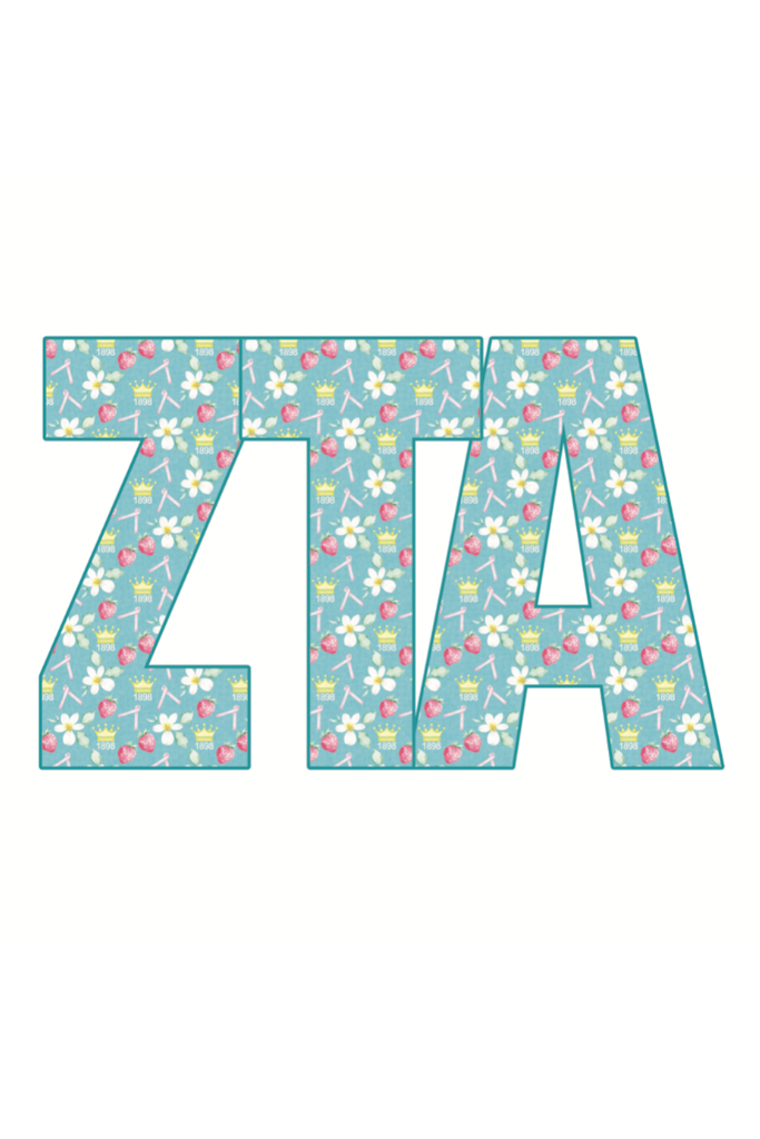 Woman holding 'ZITA' letters outdoors with greenery in the background