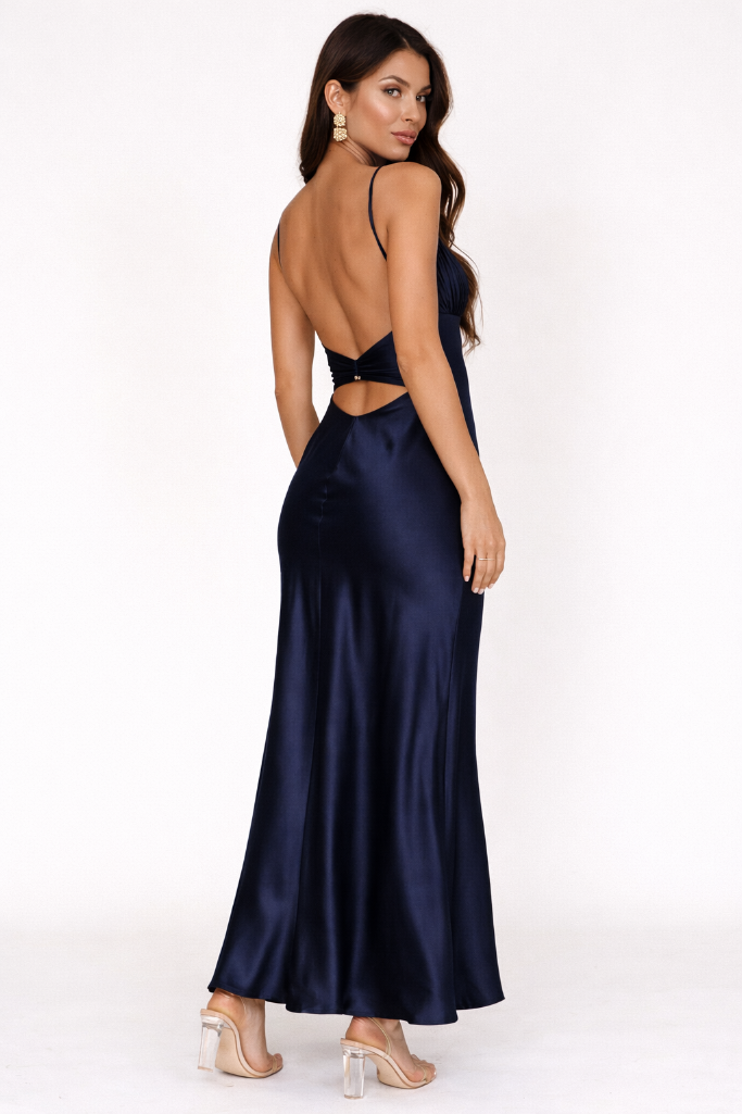 Navy satin evening gown with cut-out design on a white background