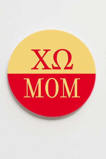Round button with 'ΧΩ MOM' text on a yellow and red background