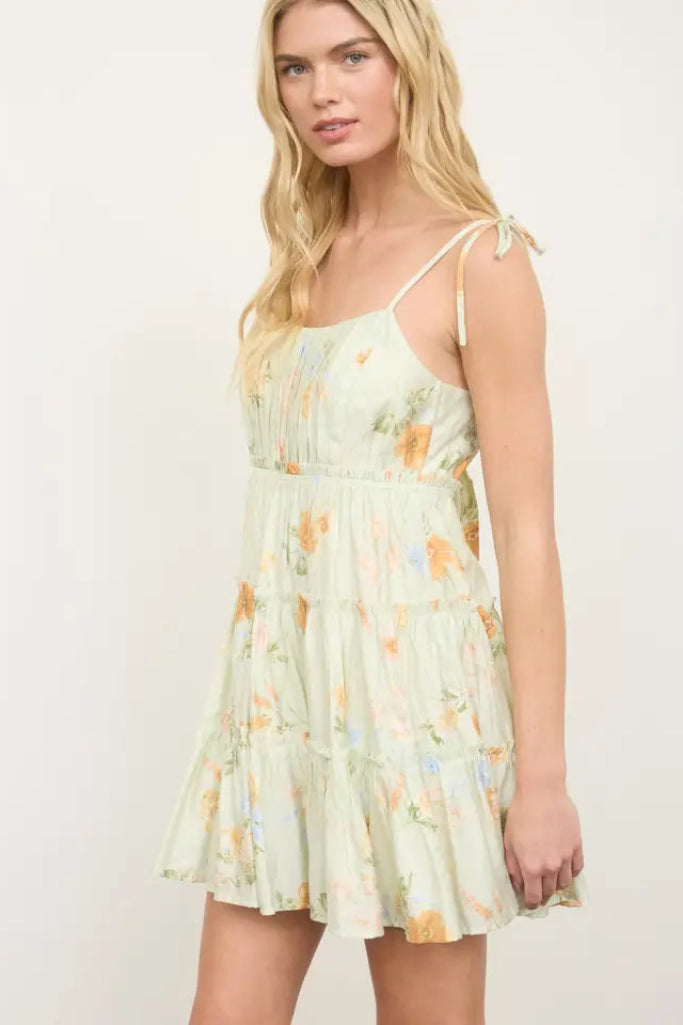 Woman wearing a floral dress on a white background