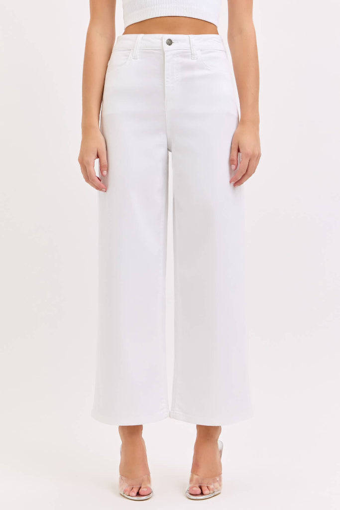 White wide-leg pants worn by a person on a white background